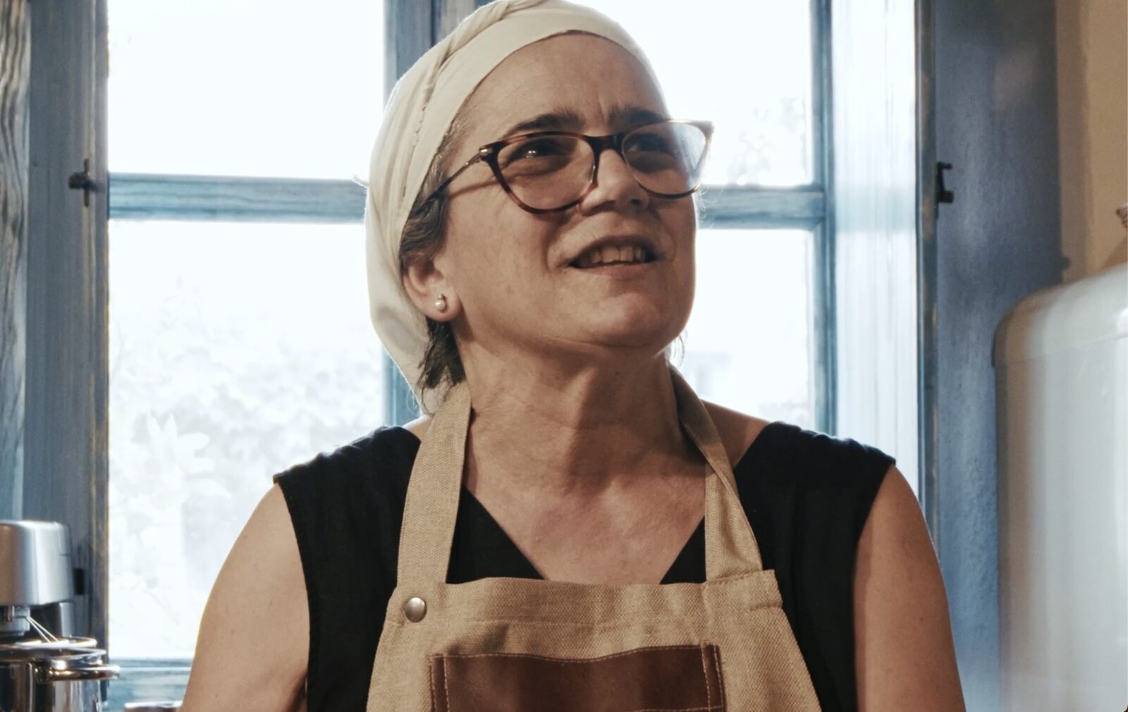 Cheesemaker in her kitchen for the Italy Segreta documentary series