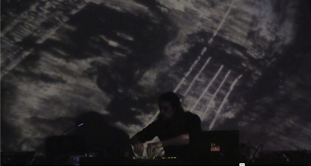 Projection still from a live set