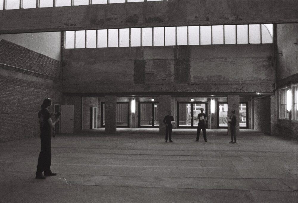 Monom, recording choir outside using the concrete building's acoustics