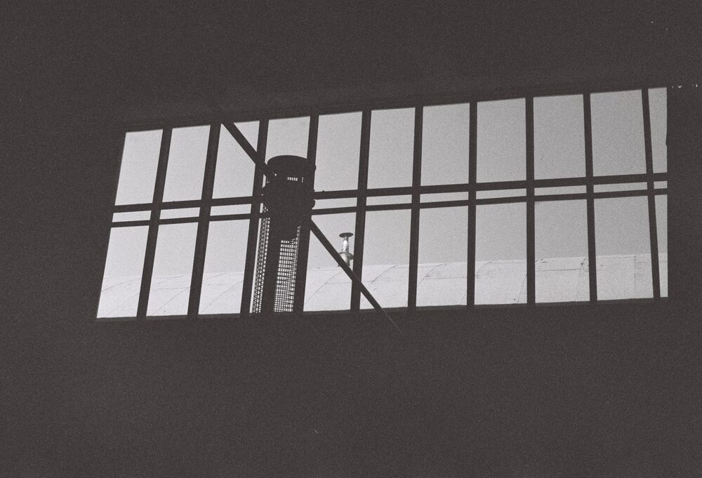 Monom, acoustic tower silhouetted against the skylight