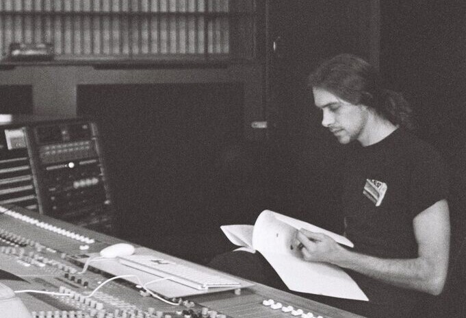 Monom, working alone at the mixing console